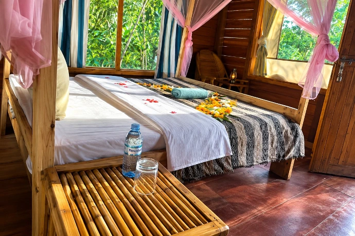 Comfortable safari cottage bedroom at Little Monkey Camp